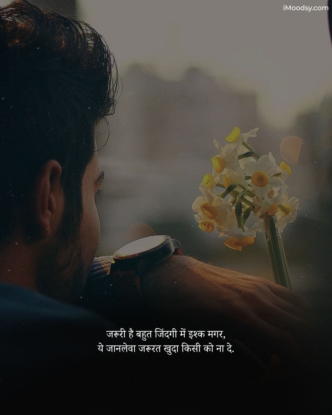Alone Sad Status in Hindi showing a man looking away with flowers, featuring deep love and loneliness Shayari from iMoodsy.com.